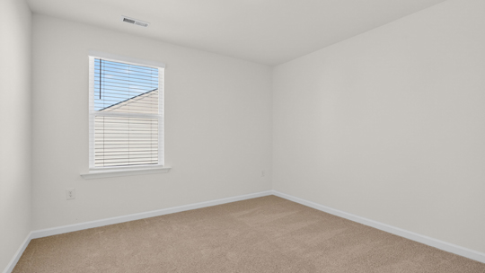 additional bedroom with window, carpeting, closet