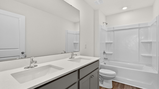 additional bathroom with double vanity sink