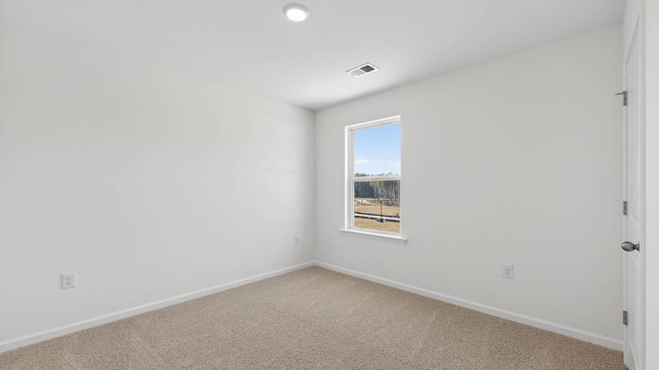 additional bedroom with window, carpeting, closet