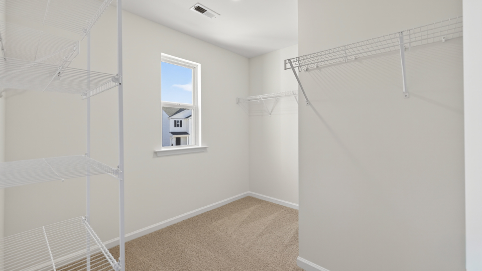 walk in closet with wire shelving