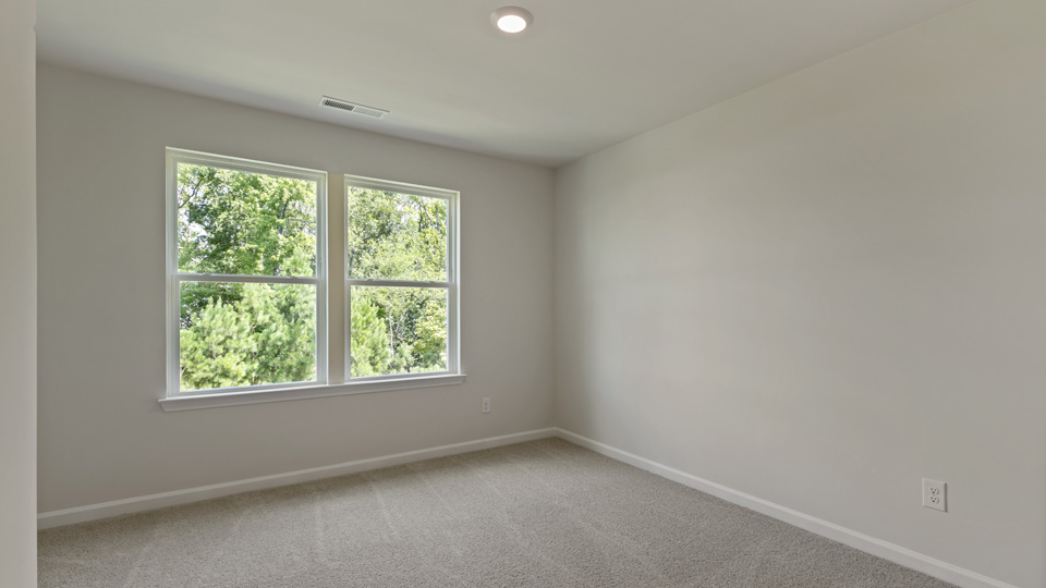 Bedroom with carpet flooring