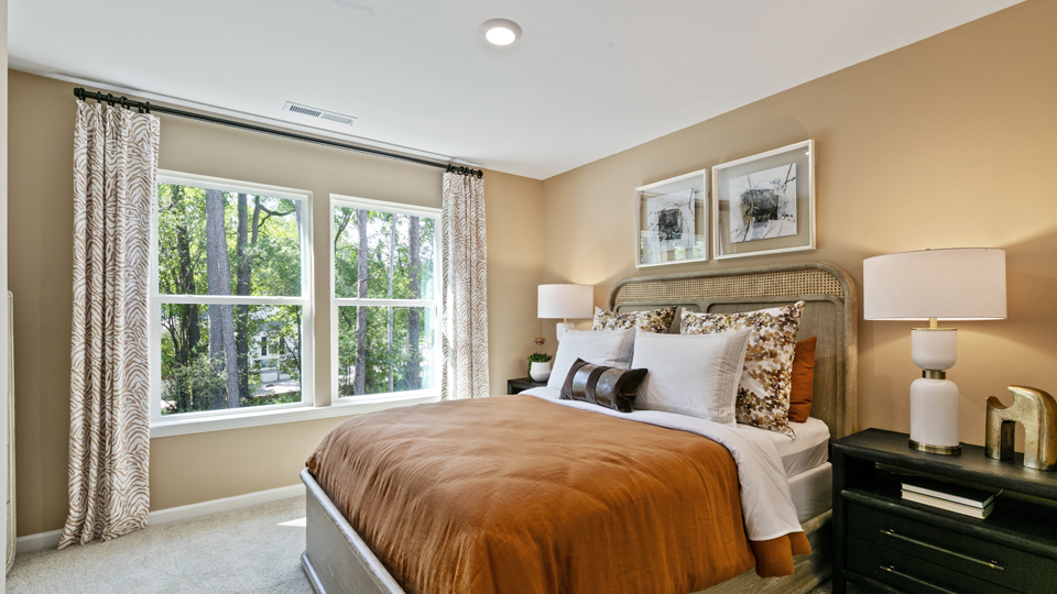 third bedroom with two large windows and carpeting