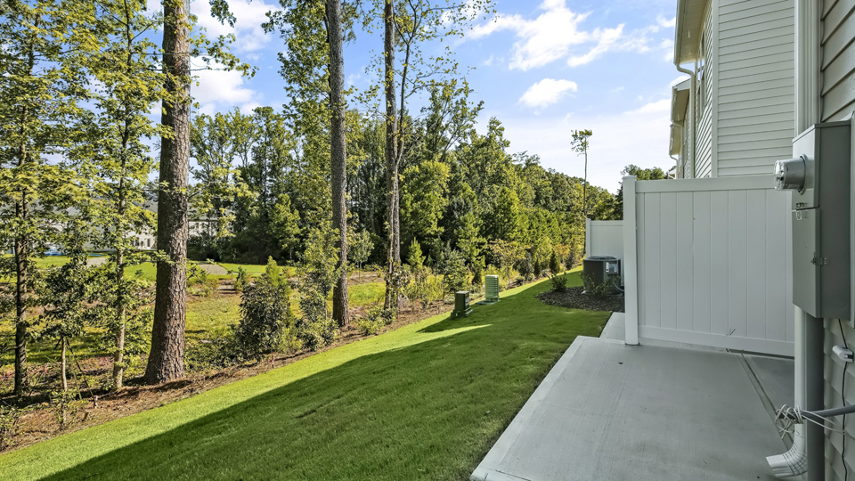 back patio with small grass yard