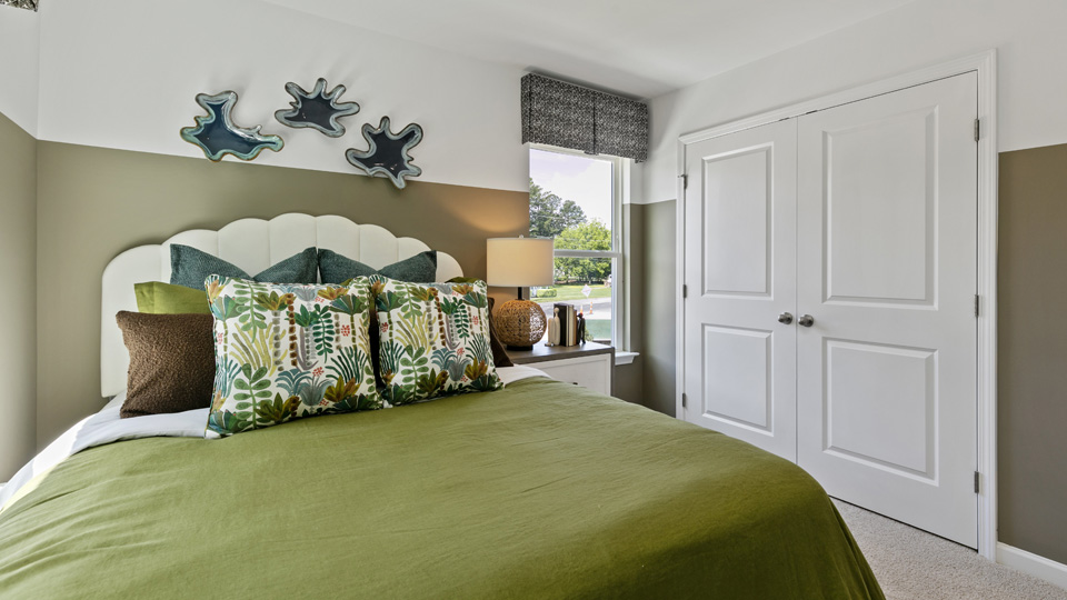 third bedroom showing walk-in closet