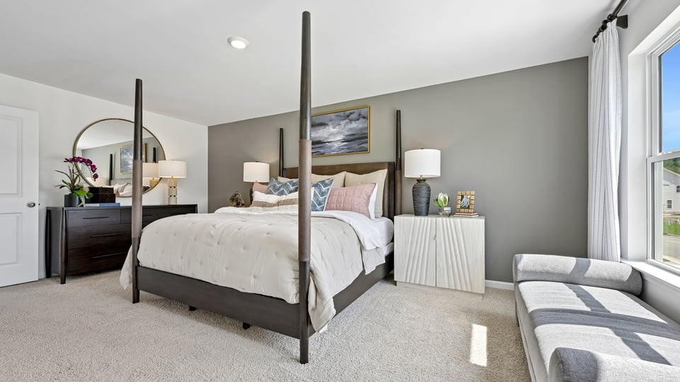 primary bedroom with carpet flooring