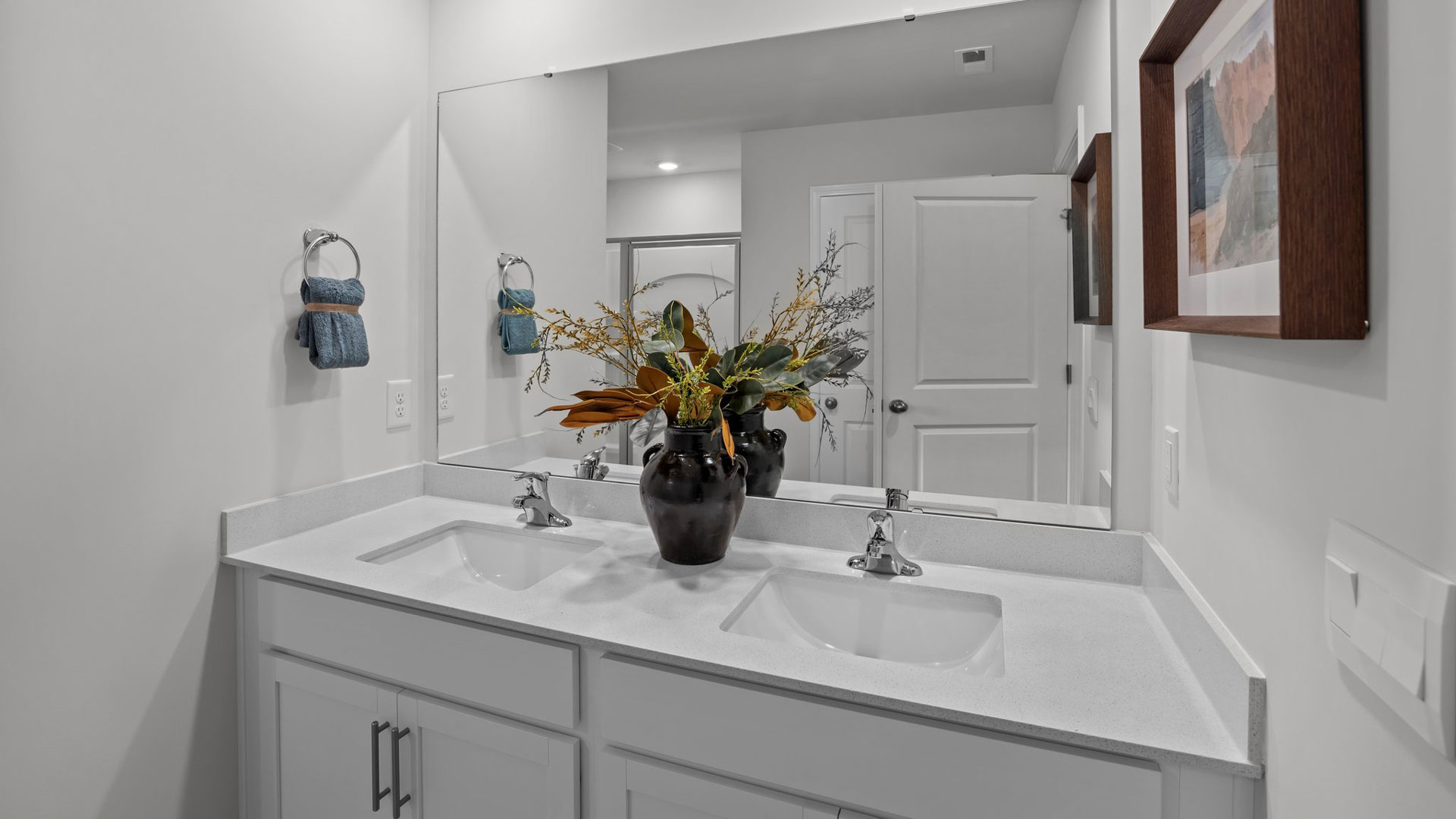 bathroom with quartz countertops and dual vanity