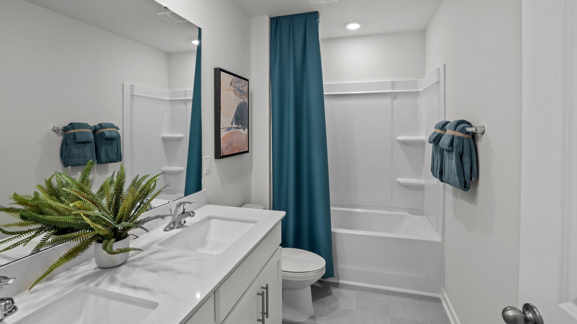 bathroom with tub shower combo and quartz countertops