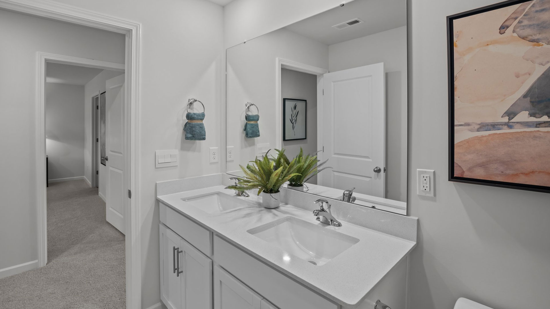 bathroom with quartz countertops and dual vanity
