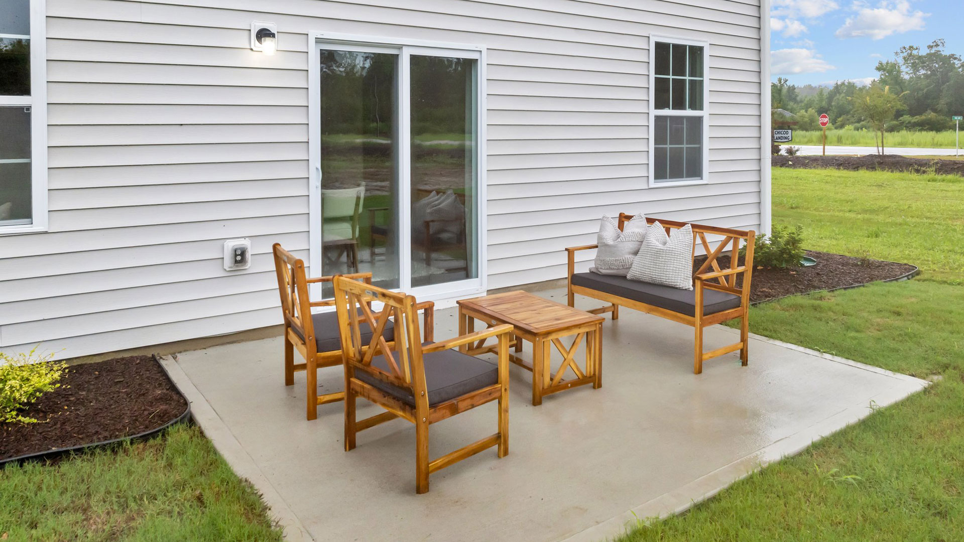 back of penwell with concrete patio