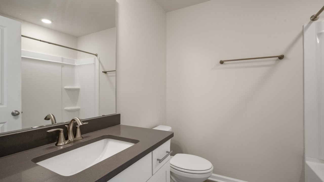 Bathroom with white cabinets