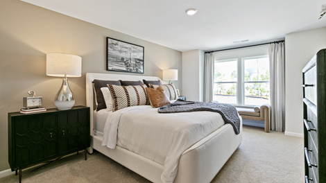 bedroom featuring a large bed, with a large window to the right of it