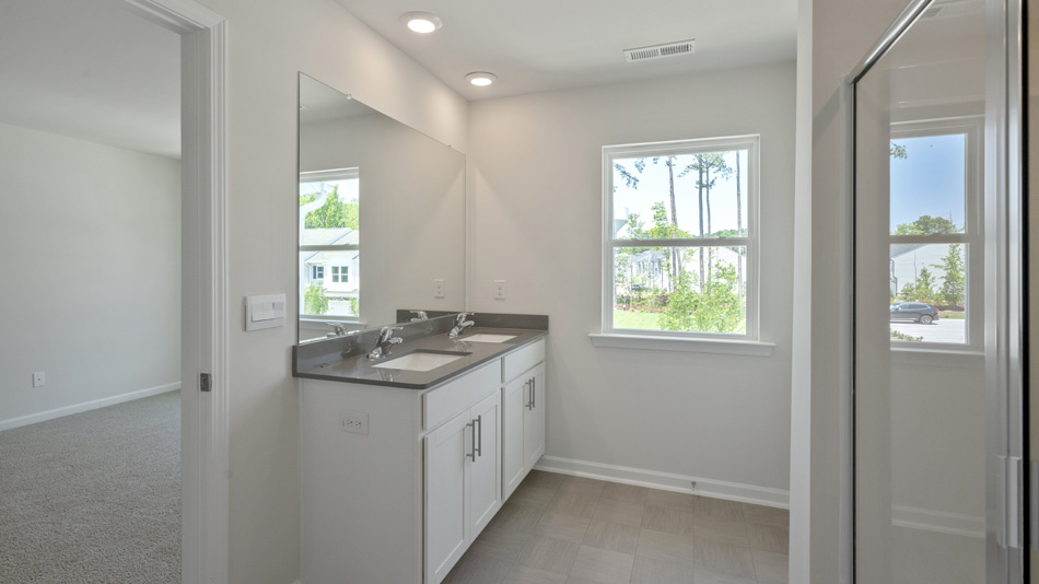Primary bathroom with quartz counters
