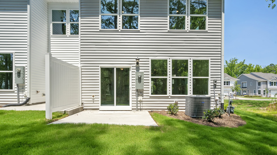 exterior patio with concrete slab and open yard