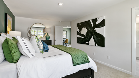 bedroom featuring green and blue decor with a large window
