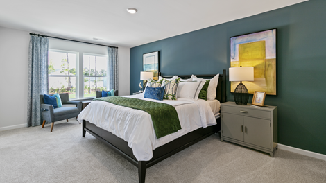 bedroom featuring green and blue decor with a large window
