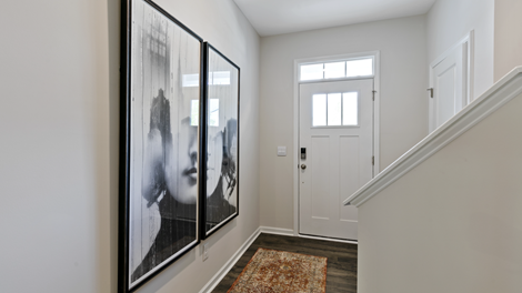 entry hallway of home featuring stairs on the right