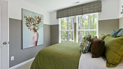 bedroom featuring olive green decor and 2 large windows