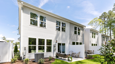 rear exterior of home featuring a concrete patio and privacy fence