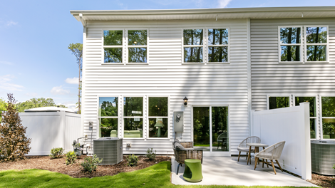 rear exterior of home featuring a concrete patio and privacy fence