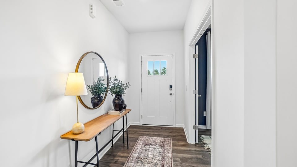 foyer entryway with revwood flooring