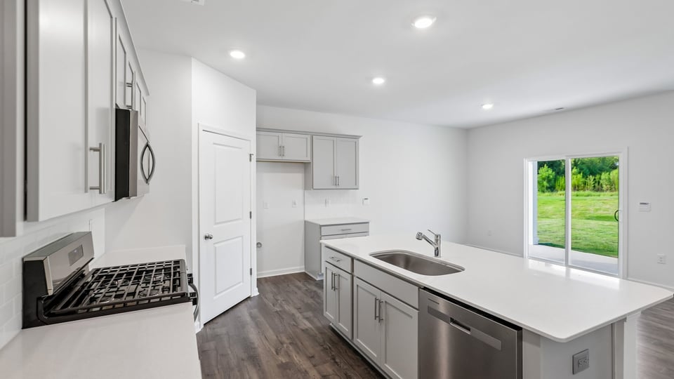 kitchen with island white cabinets and quartz countertops