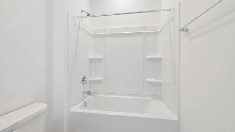 bathroom with tub shower combo