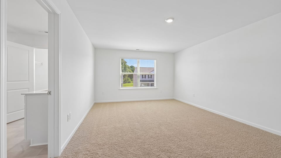 loft with carpet flooring