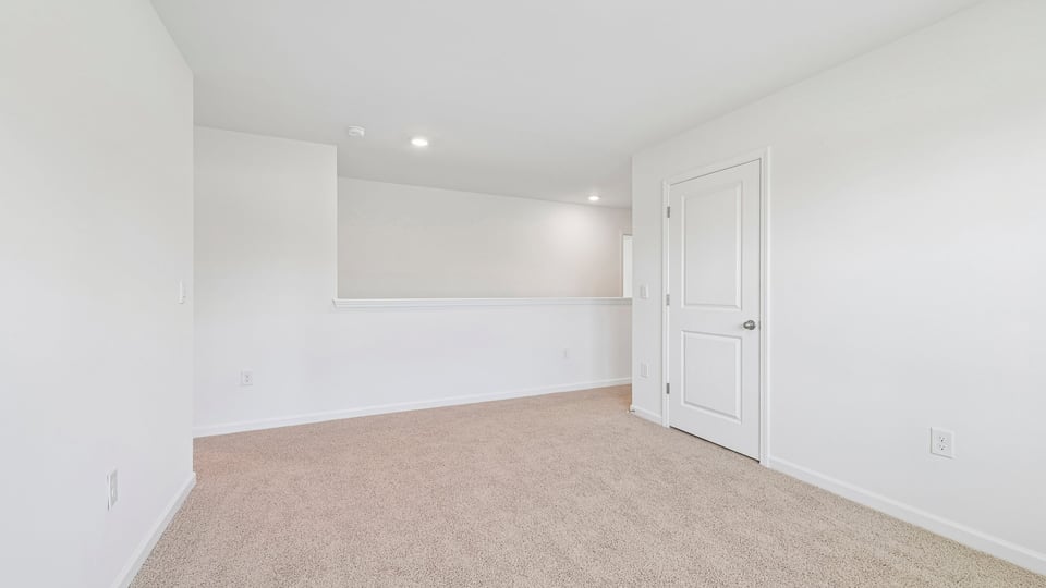 loft with carpet flooring