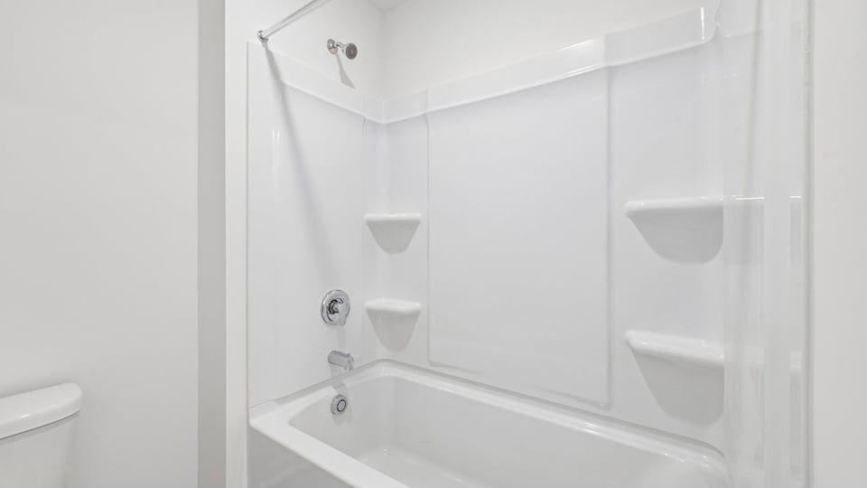 bathroom with tub shower combo