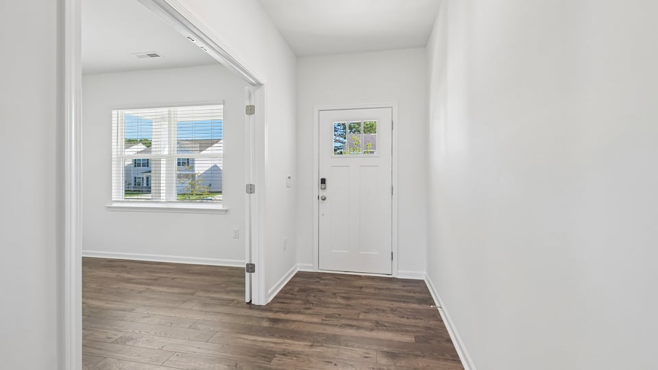 foyer entryway with revwood flooring