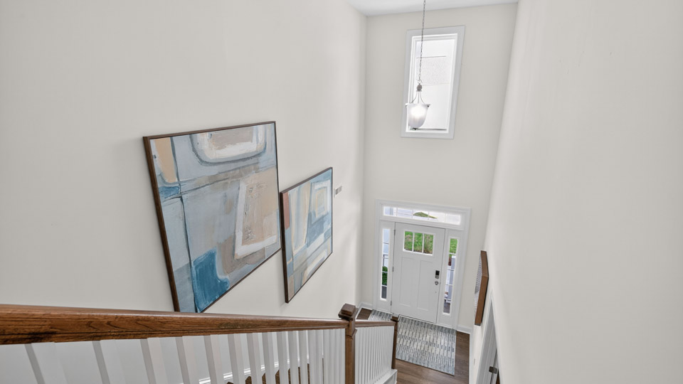 top of stairs looking down to below over foyer