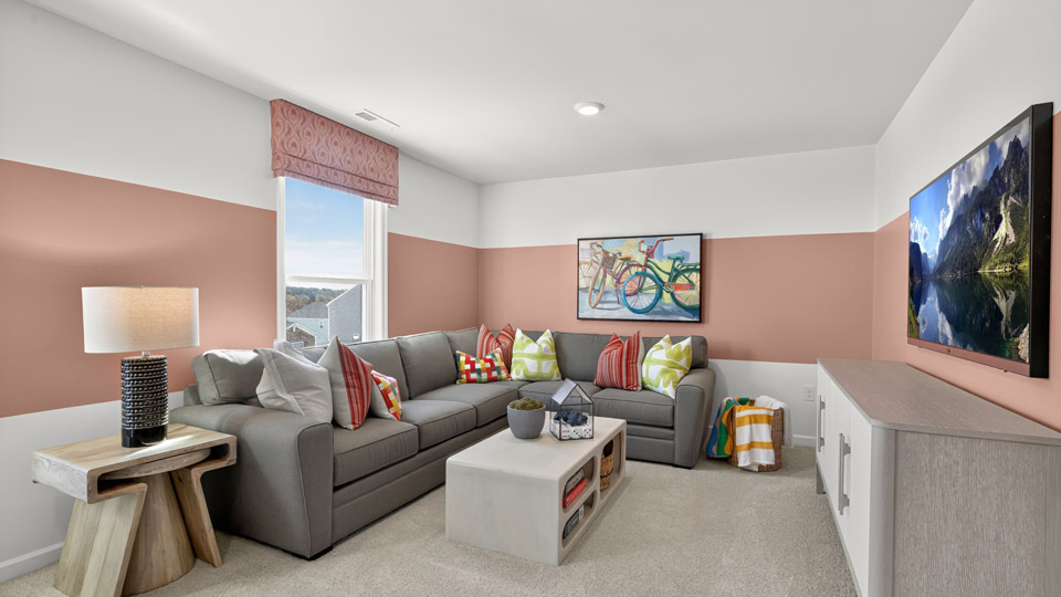 upstairs loft area with large windows and carpeting