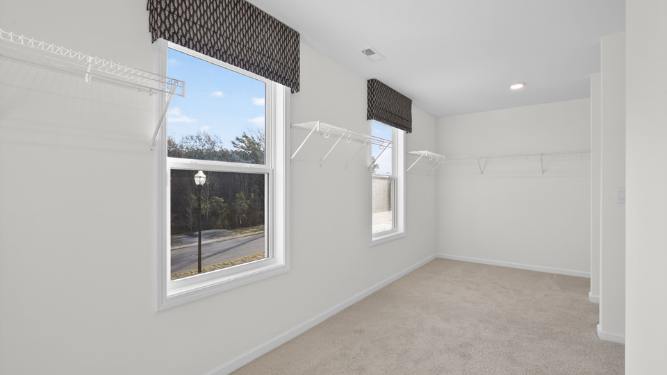 walkin pantry with windows for natural lighting and wire shelving