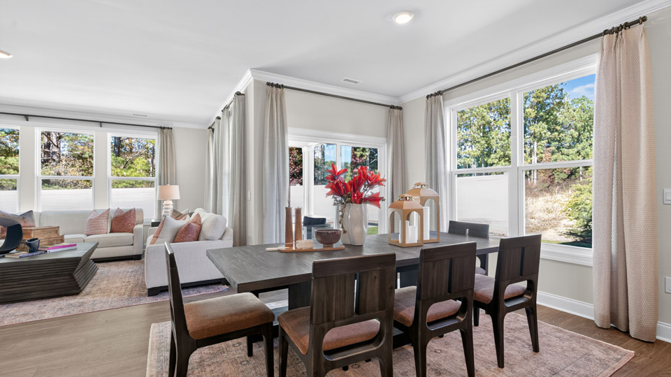 dining area with revwood flooring and natural lighting