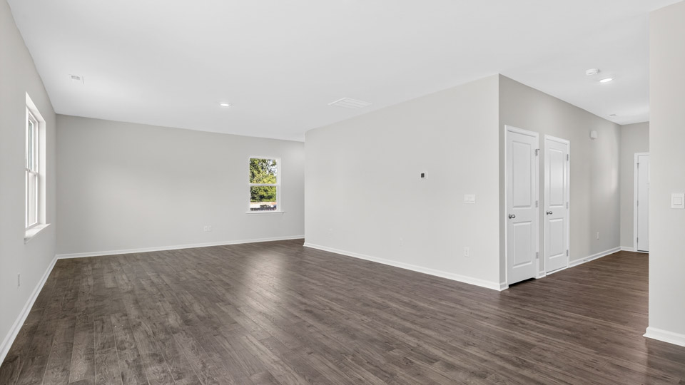 open concept living space with large windows
