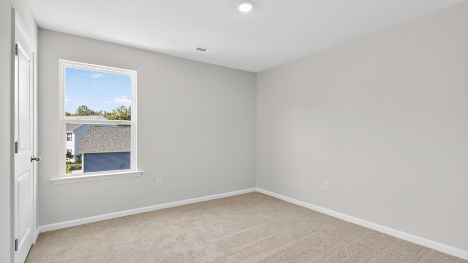additional bedroom with window, carpeting, closet