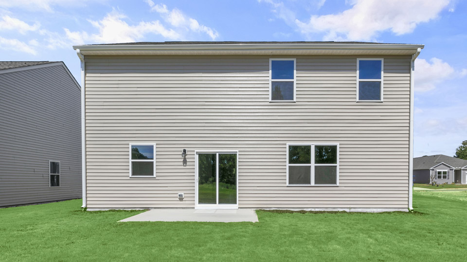 exterior patio with concrete slab and open yard