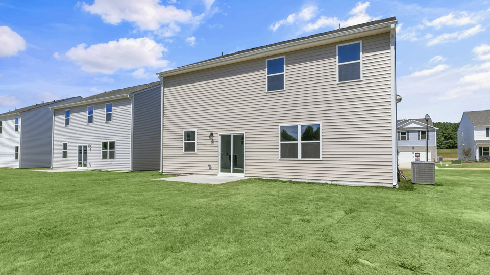 exterior patio with concrete slab and open yard