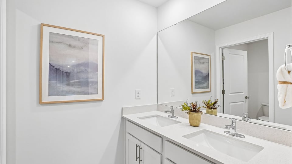 secondary bathroom with shower tub combo and single vanity sink