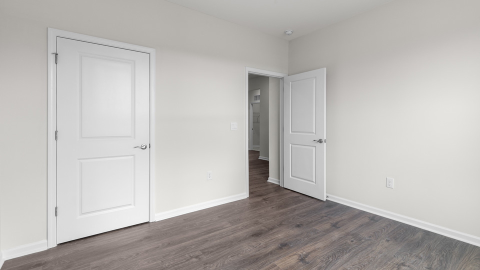 Bedroom with revwood flooring