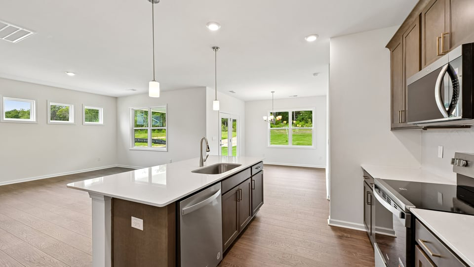 kitchen with stainless steel appliances and quartz countertops