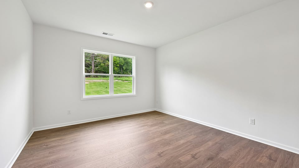 primary bedroom with revwood flooring