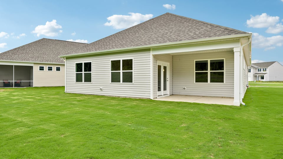 back exterior with covered patio
