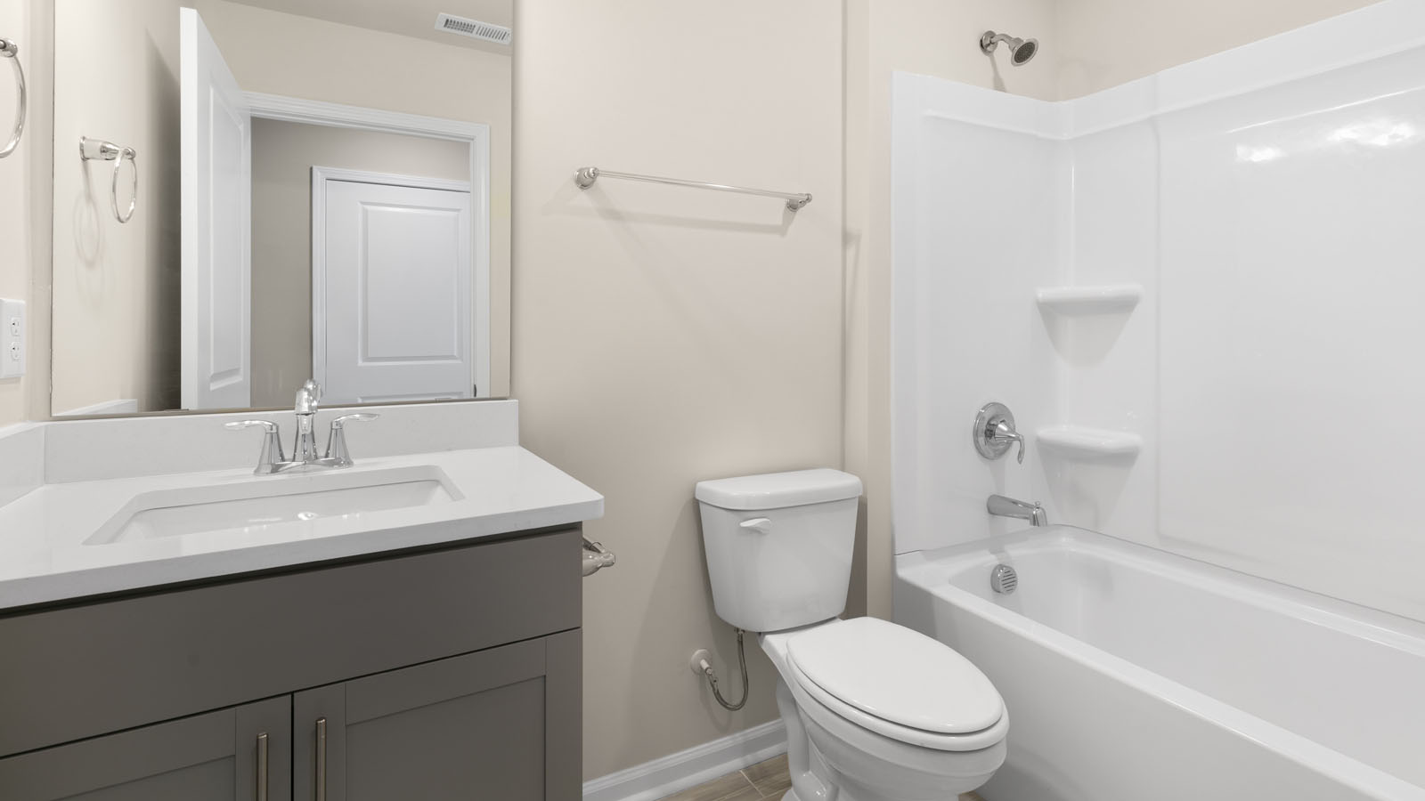 secondary bathroom with shower tub combo and single vanity sink