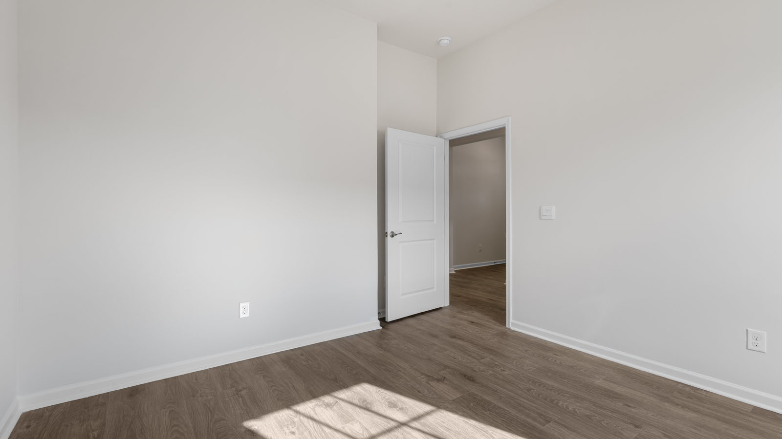Bedroom with revwood flooring