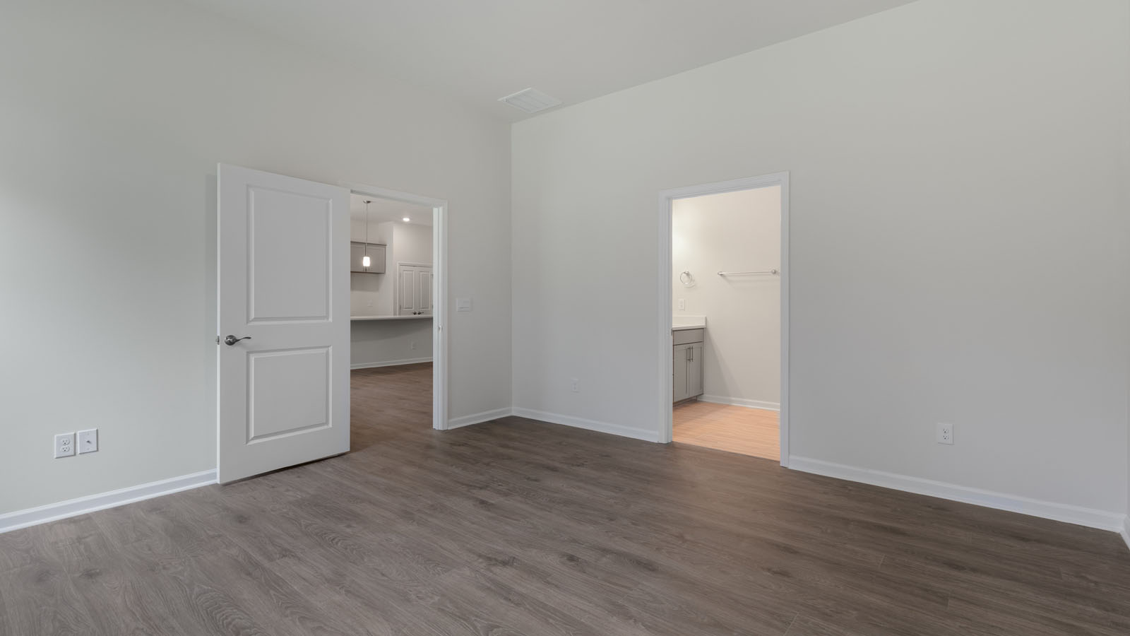 Primary bedroom with revwood flooring