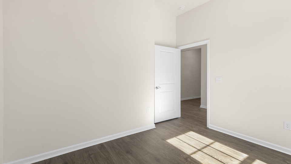additional bedroom with window, carpeting, closet
