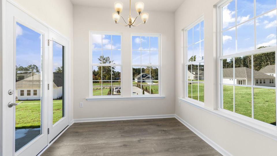 open concept dining space with door to patio