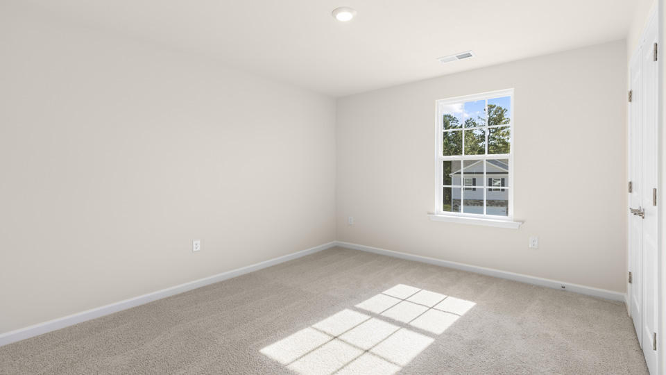 additional bedroom with window, carpeting, closet