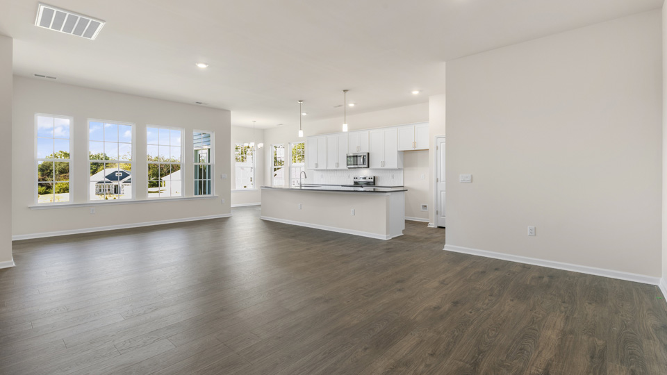 open concept living space with large windows